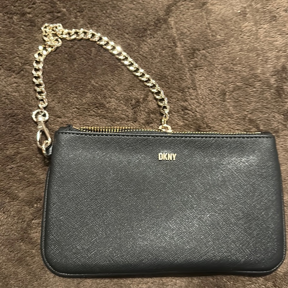 Black DKNY wristlet w/ chain. Never used. New w/o tags.